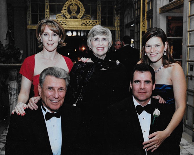 Roger Machanic with his son Bruce (front row) and daughter Laura, wife Grace and daughter-in-law Susan Machani at the wedding of a family friend in 2001.
