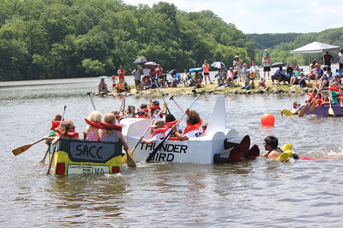 Young sailors compete in the 2015 Cardboard Boat Regatta held at Lake Accotink Park as part of the Springfield Days community festival.