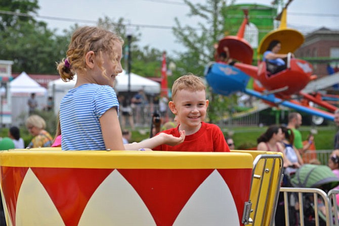 Happy faces on the Tea Cup ride for Stephanie and Nate of Herndon. The youngsters were particularly pleased because unlike typical amusement park rides, “the lines weren’t long!”
