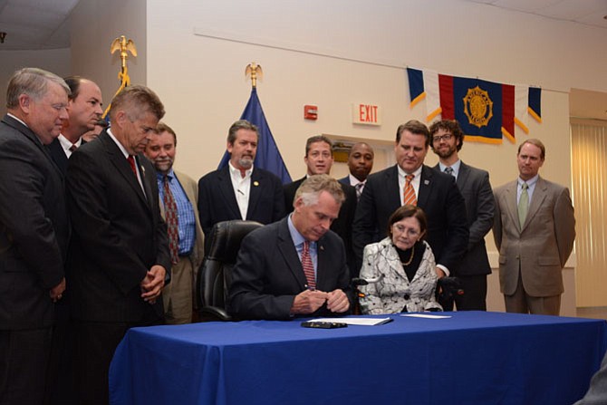 Center, Gov. Terry McAuliffe (D) signs HB 477, which allows for $29.3 million in bonds plus financing costs for constructing veterans care centers in Northern Virginia and the Hampton Roads areas.