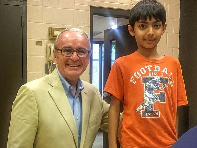 McLean Citizens Association president Jeff Barnett honors nine-year-old Lemon Road Elementary student Shray Gupta for designing MCA’s new website.
