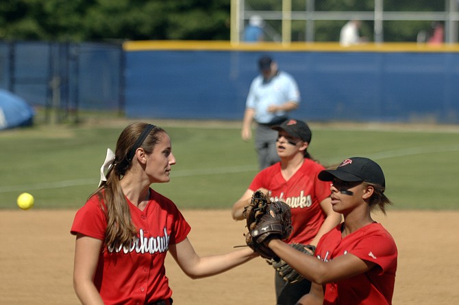 Madison left fielder Peyton Thomas, right, greets pitcher Katie Vannicola during the Warhawks' 4-0 win over Grassfield in the 6A state semifinals on Friday. Vannicola threw her first high school no-hitter, helping the Warhawks return to the state final for the first time since 2004.