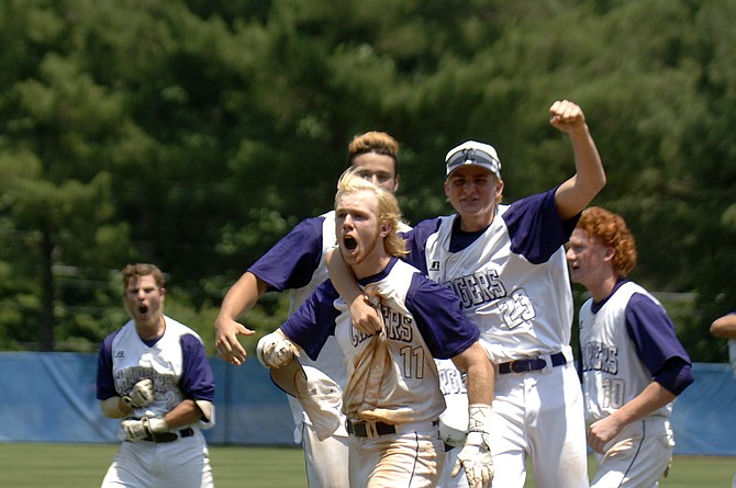 Teammates celebrate with Jared Enders (11), whose walk-off RBI single gave the Chantilly baseball team a 3-2 win over Battlefield in Saturday’s 6A state championship game.