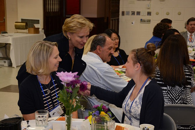 Fairfax County Public Schools Superintendent Dr. Karen Garza (left) visits with 2016 Robinson Secondary School graduate and Fairfax Station resident Wesley Kittelberger (right) at the Fairfax County Retired Educators luncheon June 9.