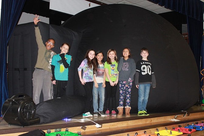 Students at Park Ridge Elementary stand outside Marymount University’s Myhill Portable Planetarium. They were concluding their study of the solar system. From left are D'Brickshaw Davis, Jackson Dixon, Sofia Bragin, Lily Canales, Bailey Gibson, Isabella Mayorga and Chase Krause.
