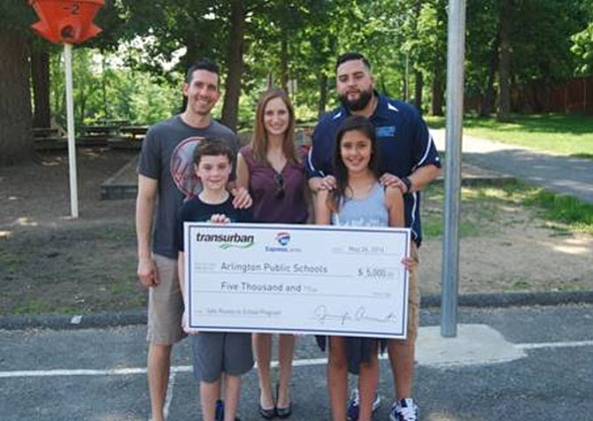 From left are Joe Reed, physical education teacher at Abingdon Elementary School; Christine Manley, corporate relations associate at Transurban; Mike Collazos, physical education teacher at Abingdon Elementary School; and two Abingdon Elementary School students.
