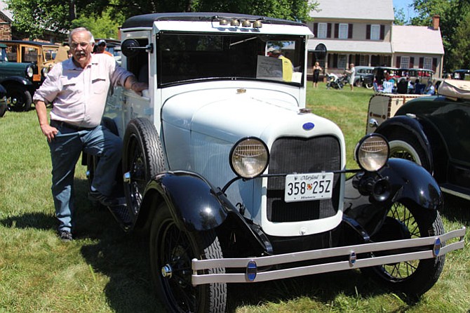 Rick Heyer poses with the 1930 Ford ice cream truck he restored after finding it sitting in a barn for more than 30 years. Fully operational, Heyer keeps the ice cream in the back cool with dry ice.
