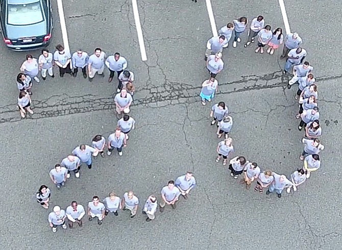 Mountain View staff members form a 20 to symbolize the school’s 20th anniversary.
