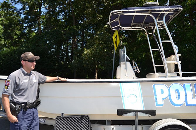 Officer Brian Bowman with the Marine Patrol boat. 