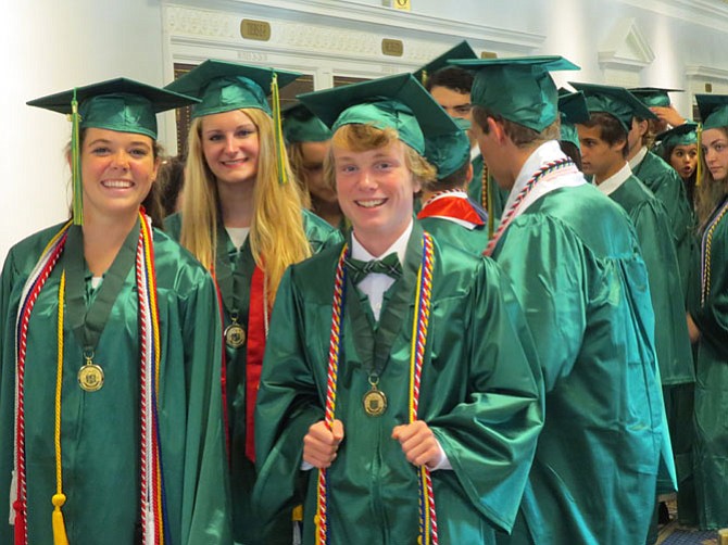 Michaela Christine Purdy, Audrey Elizabeth Fahlberg and Brendan Thomas Coffey pave the route toward graduation.
