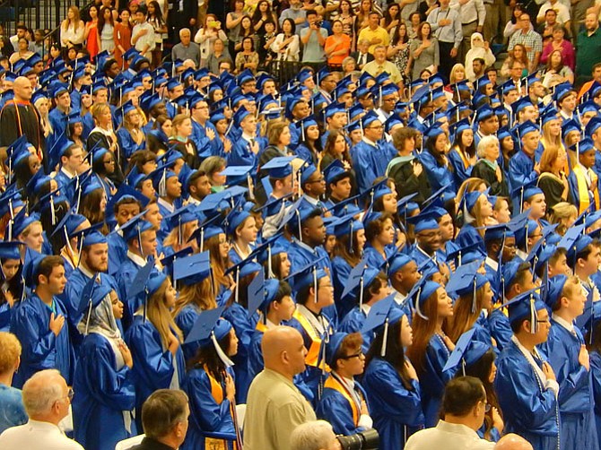 Saying the Pledge of Allegiance at the start of the ceremony.
