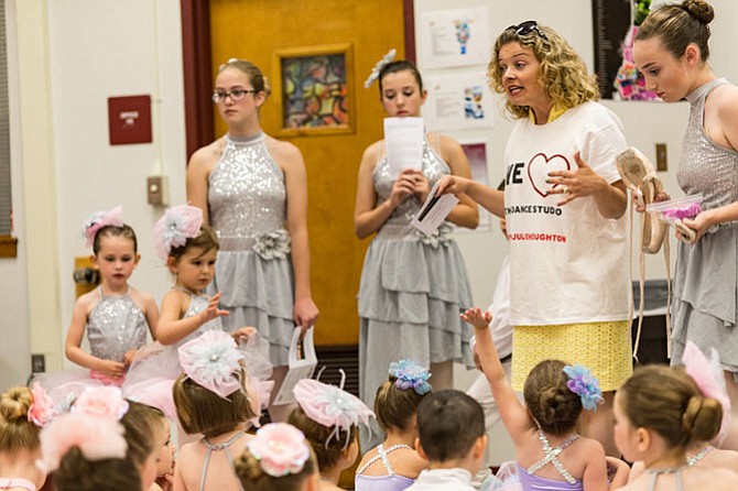 Julie Houghton has help from her daughter as well as the older dance students in organizing all of the children for their performances.

