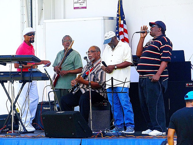 Al Munzie and members of The Renaissance Gospel Singers perform during the community day celebration.
