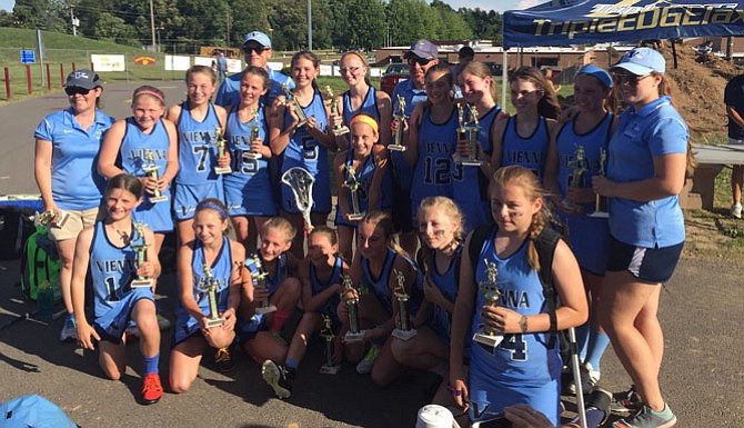 Vienna Hawks team members, by number and name: 1, Daisy Anderson; 2, Devon Almquist; 3, Avery Bath; 4, Maegan Boughton; 5, Nina Conforti; 6, Ava Dirth; 7, Caroline Fitzpatrick; 8, Kaela Gordon; 9, Emily Knisley; 24, Jill Koshuta; 11, Katie Koshuta; 12, Sophia Laubner; 13, Emily Martin; 14, Sydney Martin; 15, Eve McDonough; 16, Mary Grace Songer; and 17, Emme Williams. Coaches: far left, Kesley Anderson; left middle Mike Anderson; back center, Scott Knisley; far right, Paige Knisley.
