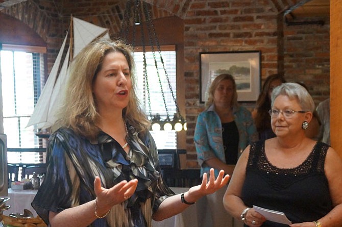 Mayor Allison Silberberg applauds the efforts of the Board of Lady Managers as the organization’s president Connie Blood looks on.
