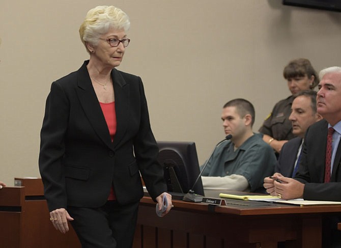 FAIRFAX VA, JUNE 24: Anne Geer, left, walks past Fairfax County police officer Adam D. Torres, 2nd left, after she read a statement to the judge for Torres' shooting of her son, John B. Geer to death as he stood unarmed in the doorway of his Springfield home in August 2013.  Torres was sentenced today, he pleaded guilty to involuntary manslaughter in April. Photo made at the Fairfax County Courthouse in Fairfax VA, June 24, 2016. (Photo by John McDonnell/Pool/ The Washington Post)