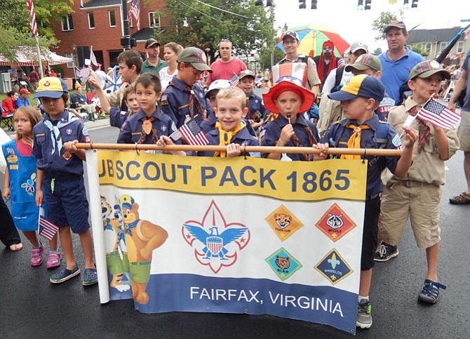 Cub Scouts pose for a photo during last year’s parade.
