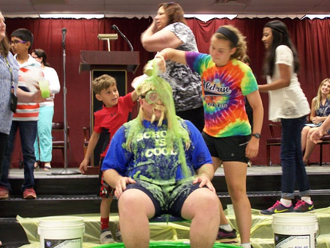 Principal fulfills promise to get "slimed.’
