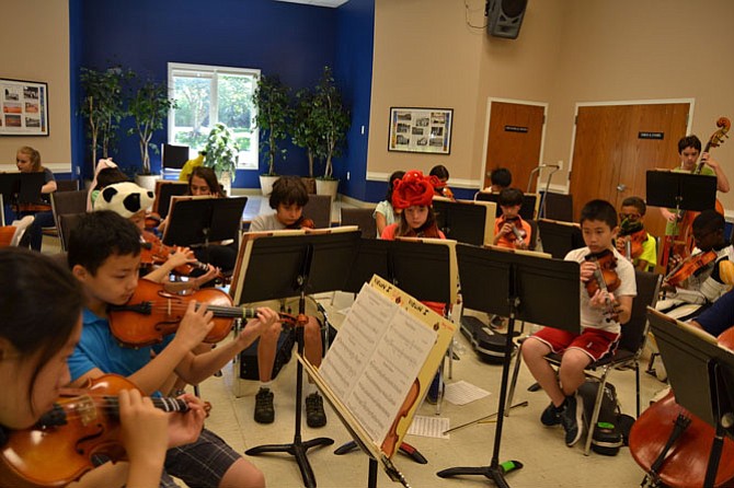 Campers rehearsing during Summer Strings Camp. 
