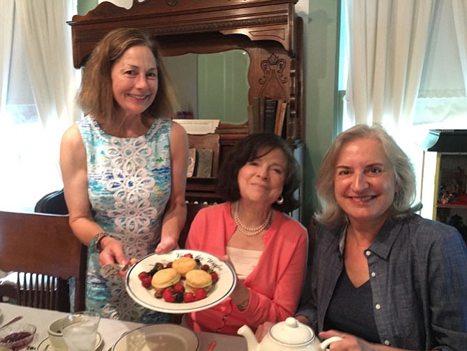 Nancy Moats of Historic Vienna, Inc. co-hosted the “tea” featuring 19th-century social activist Elizabeth Cady Stanton. Guests Nedda R. Thomas [left, seated] and Kata Baroloni-Tuazon support HVI’s programs.

