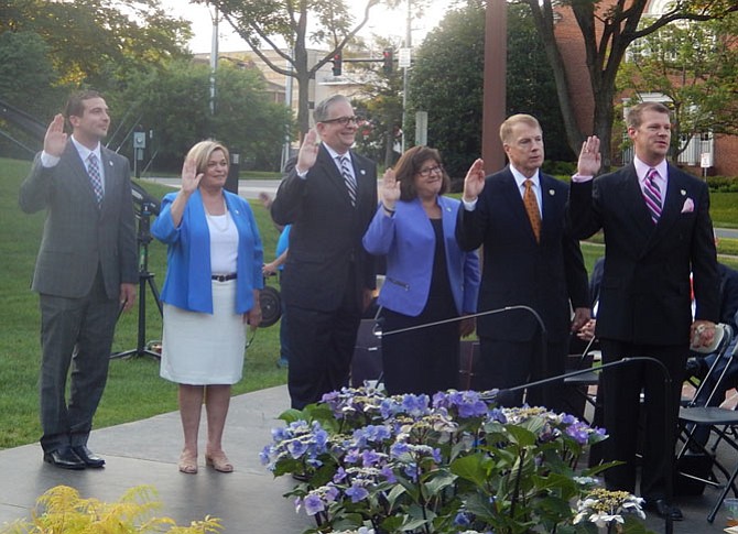 (From left) Jon Stehle, Janice Miller, Michael DeMarco, Ellie Schmidt, David Meyer and Jeff Greenfield are sworn in.

