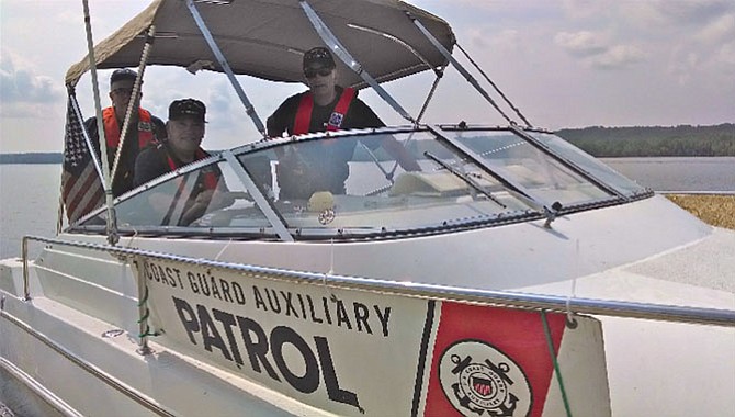 Close up of a Flotilla 25-08 crew during a refueling stop on Piscataway Creek midway through a patrol, summer of 2014. 
