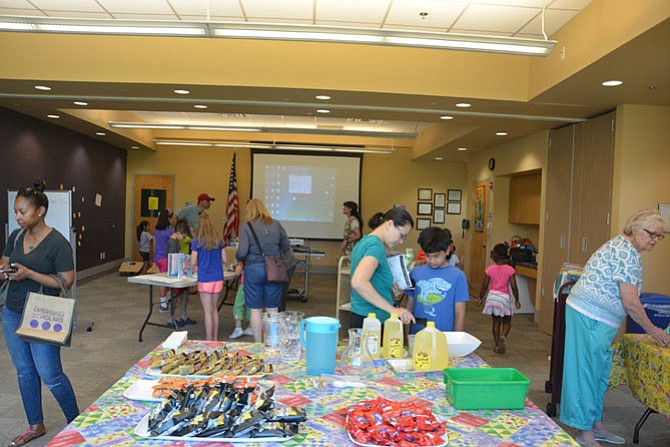 Families enjoy themselves attending the Burke Centre Library's kick-off event for the summer reading program.
