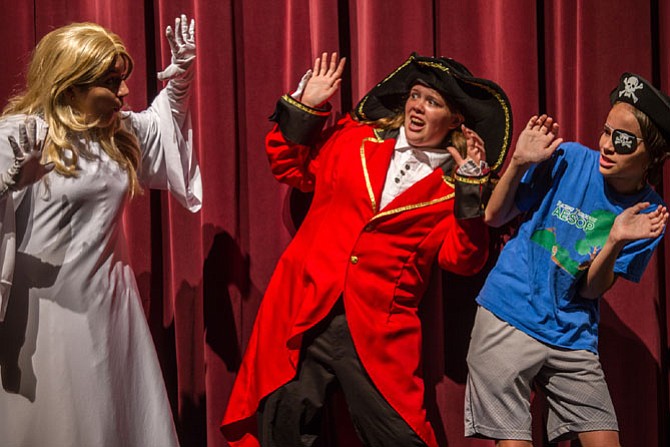 From left: Megan Dinnenn (Harriet the Ghost), Samantha York (Capt. Cranky Bones) and Jared Belsky (Theodore) rehearse a scene.
