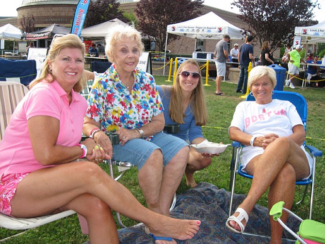 Nancy Wood of Herndon, Dottie Bartholomew of Stuart, Fla., Debbi Perla of Westminster, Md., and Kelly Burishkin of Acushnet, Mass, enjoy the concert.

