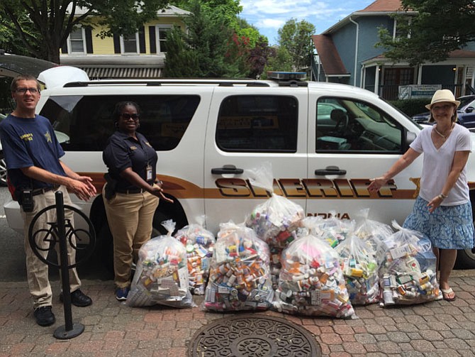 Volunteer Cullen Prall, Sheriff’s Deputy Valarie Wright, and SAPCA Vice Chair Shelly Morgan, stand with full bags of unused, unwanted and expired prescription drugs.
