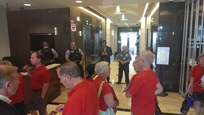 Security initially formed a line between demonstrators and the hallway to the Fairfax County School Board work session on July 21, but eventually they were allowed through.