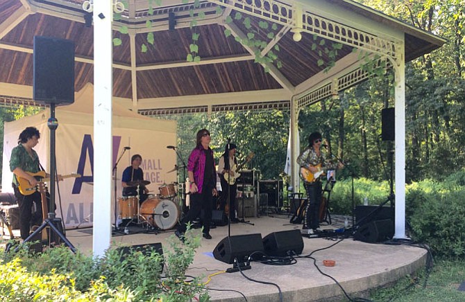 Satisfaction performs at McLean Central Park. Frontman Chris LeGrand, who plays Mick Jagger in Satisfaction’s shows, founded the group in 2001.
