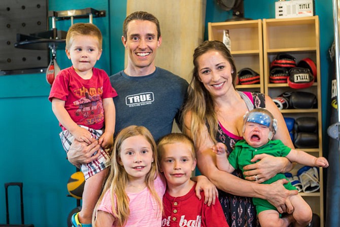 Nina and Christian Elliot plan ahead to incorporate a healthy diet and exercise into family vacations with their children Naomi, 8, Caleb, 6, Noah, 2, and Cohen, 7 months.
