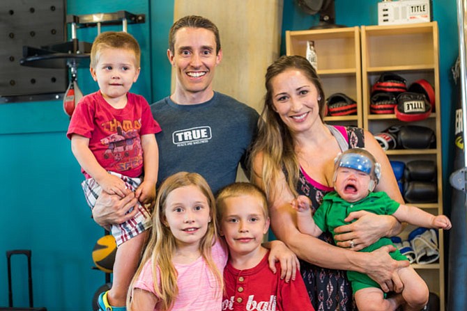 Nina and Christian Elliot plan ahead to incorporate a healthy diet and exercise into family vacations with their children Naomi, 8, Caleb, 6, Noah, 2, and Cohen, 7 months.
