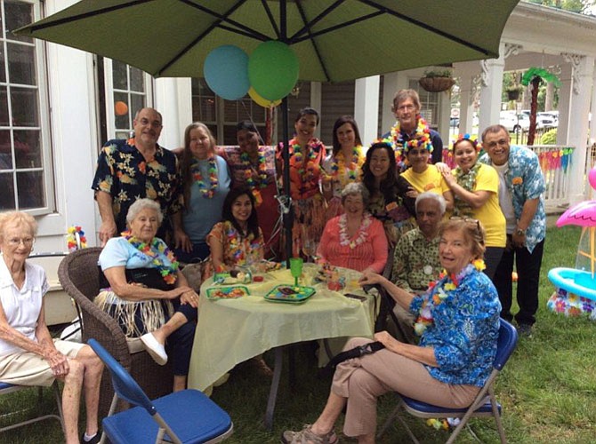 Sunrise Senior Living residents and staff enjoy a luau party.
