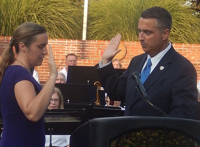 City Clerk Melanie Crowder administers the oath of office to Fairfax Mayor Scott Silverthorne on June 30.
