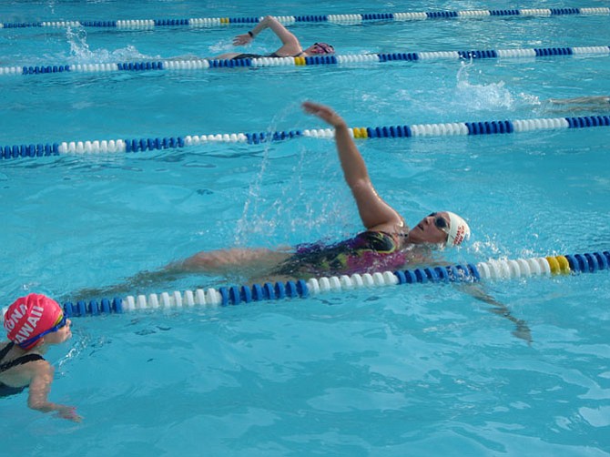 Engie Mokhtar of Kingstowne swims backstroke during the 2015 Swim for Engie breast cancer research fundraiser.
