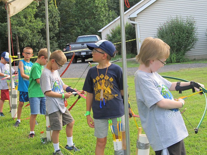 Activities for Cub Scouts at Twi-Light Summer Camp included archery, BB gun shooting, building catapults and making putty. 
