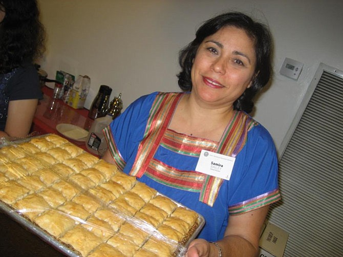 Samira Bailey holding a tray of baklava
