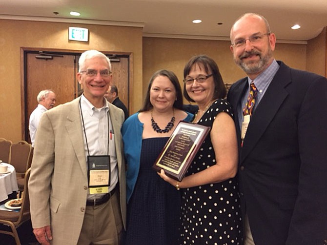 Rev. Ernest Krug (left) and Rev David Young (right), of the Presbyterians for Disability Concerns present the Nancy Jennings award to Elizabeth and Susan Lydick (middle) of Burke Presbyterian Church for their TreeHouse Ministry.


