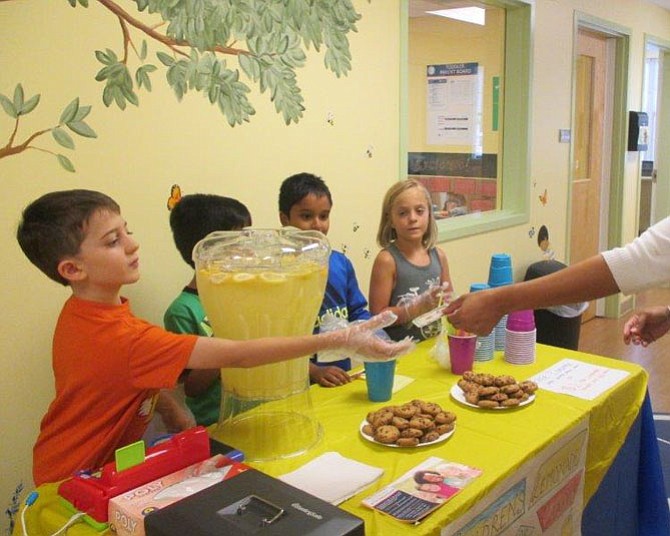 The Goddard School in Herndon students learn about business and charity by organizing their own lemonade stand with the proceeds going to LINK Against Hunger.
