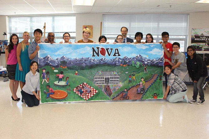 TJHSST students display a mural they created for NOVA Pediatrics and Young Adult Medicine in Springfield.
