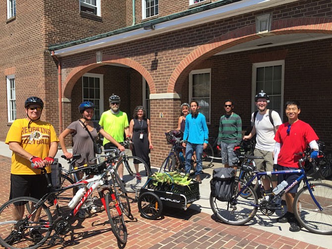 Volunteers prepare for their bike trip to deliver food to the Annie B. Rose home.
