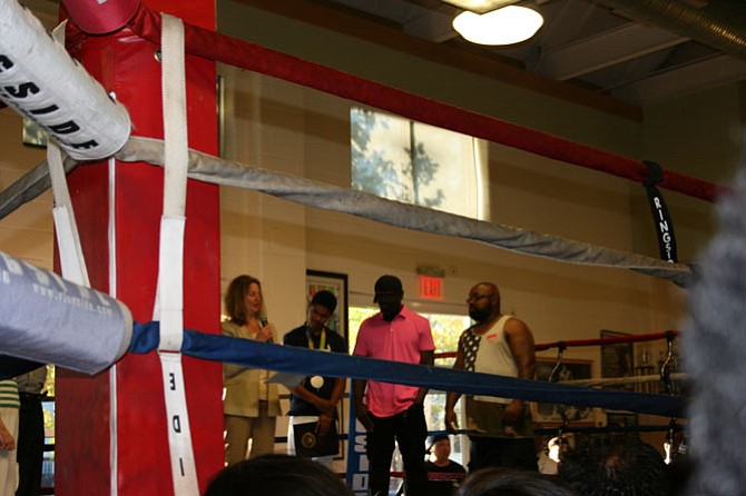 Mayor Allison Silberberg praises Olympian boxer Shakur Stevenson at the Alexandria Boxing Club. 

