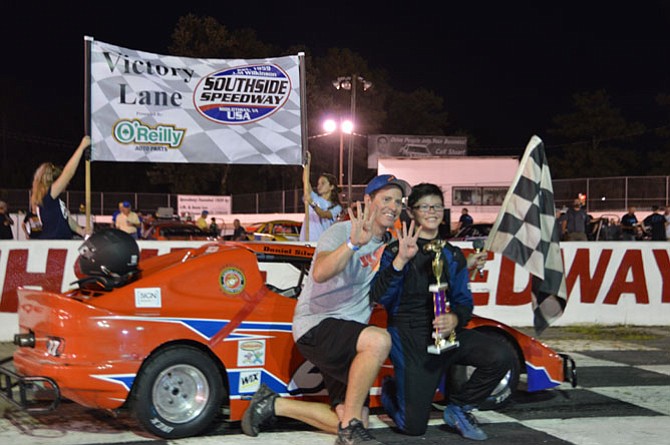 Daniel Silvestri next to his father Brian Silvestri after finishing  first for the fourth time this season at Southside Speedway.