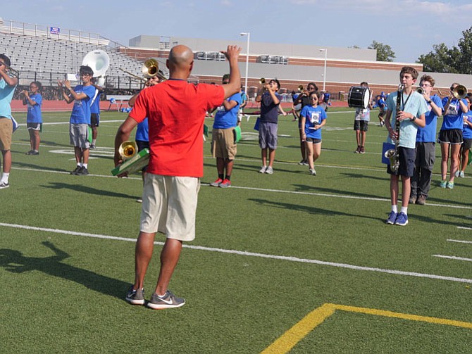 Carlos Gonzalez has run through drills and practice notes during the first day of school marching band practice. Now it is time to play together in preparation for the football game halftime shows. Gonzalez says they have played once already as a showcase for the parents on Aug. 26, the last day of Summer Band Camp. 
