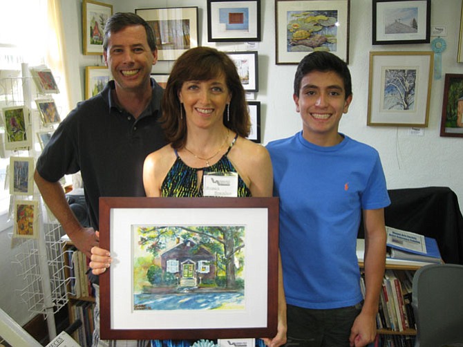 Susan Scanlon with husband Tom and son Dylan received Honorable Mention for her piece, "Vienna Arts Society House."
