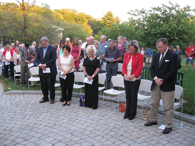 About 50 members of the audience say a prayer during the 9-11 Memorial Ceremony in Great Falls.
