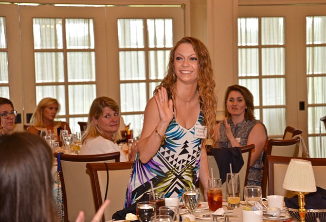 Lucy Spring had best get used to standing for applause. Taking her bow at the Great Falls Friends and Neighbors luncheon, the GMU student is the recipient of the Betty Carter Scholarship for Dance.
