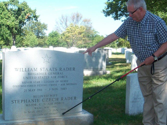 Ken Elder, executor of Stephanie Czech Rader’s Estate, inspects her gravestone.

